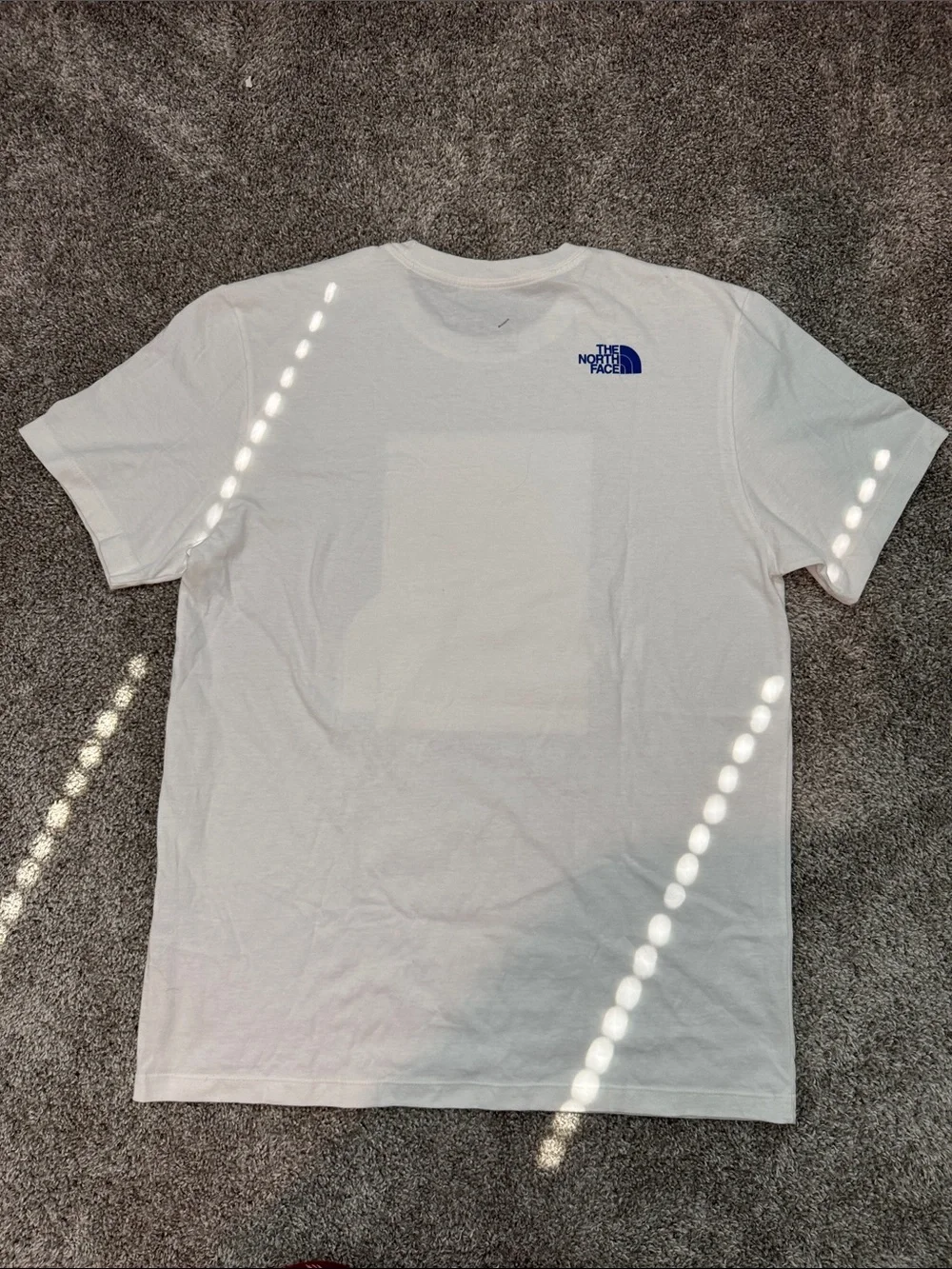 The North Face White Tee with Red & Blue Karakoram Graphic